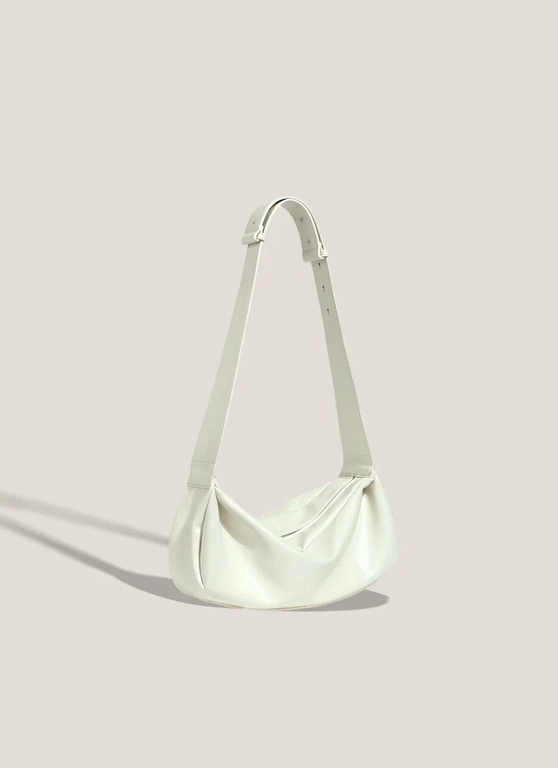 Creamy Tone Soft Curved Leather Bag with Wide Buckle Strap for Minimalist Daily Wear